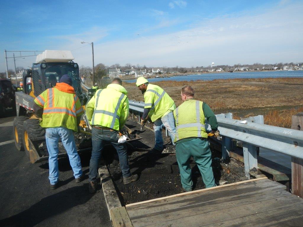 Department of Public Works Highway employees working on road